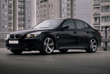 Front view of BMW M5 E60 on rooftop in city